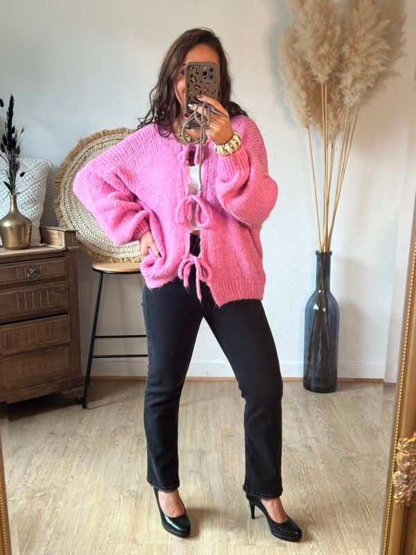 Pull grosse maille rose a lacets à nouer