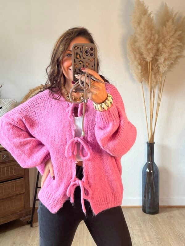 Pull grosse maille rose a lacets à nouer
