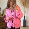 Pull grosse maille rose a lacets à nouer
