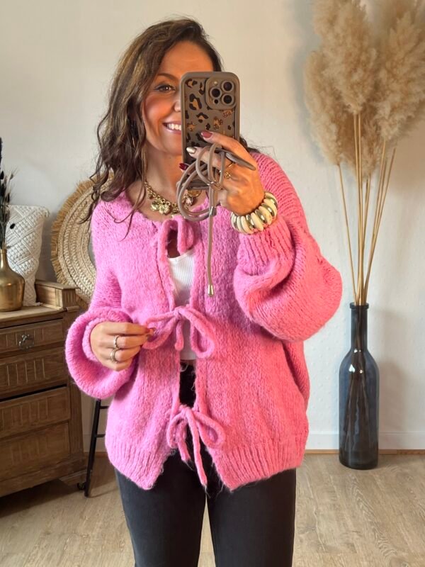 Pull grosse maille rose a lacets à nouer